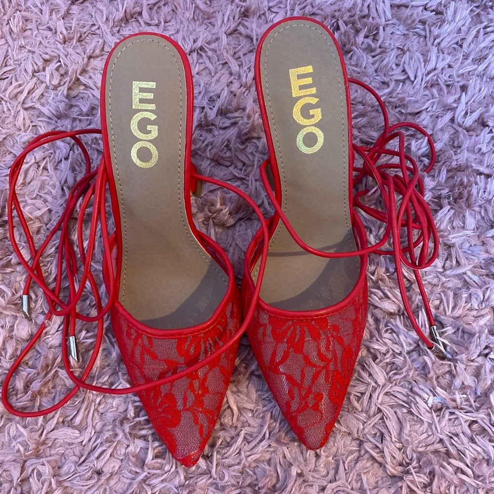 brand new EGO heels in red, lace pointed toe with a sculpted heel.